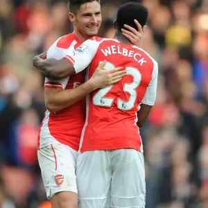 Arsenal's Premier League Victory: Giroud and Welbeck Celebrate with Arms Raised