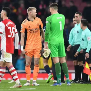 Arsenal's Ramsdale and Pope Share a Moment After Arsenal v Burnley Match