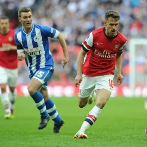 Arsenal's Ramsey Clashes with Wigan's McManaman: FA Cup Semi-Final Battle Arsenal's Ramsey Clashes with Wigan's McManaman: FA Cup Semi-Final Battle