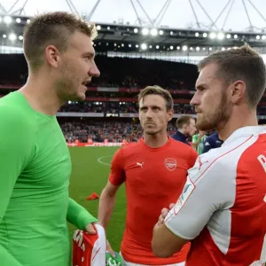 Arsenal's Ramsey and Monreal Converse with Bendtner of Wolfsburg Post-Emirates Cup Match