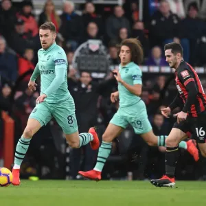 Arsenal's Ramsey Outmaneuvers Bournemouth's Cook in Premier League Clash Arsenal's Ramsey Outmaneuvers Bournemouth's Cook in Premier League Clash