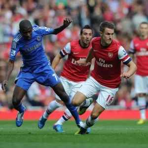 Arsenal's Ramsey Outmaneuvers Chelsea's Ramires in 2012-13 Premier League Clash Arsenal's Ramsey Outmaneuvers Chelsea's Ramires in 2012-13 Premier League Clash