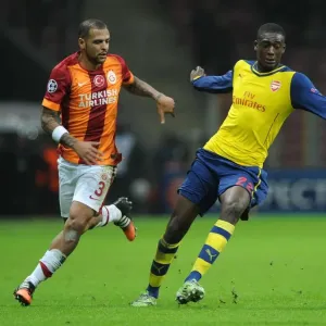 Arsenal's Ramsey Outmaneuvers Galatasaray's Melo in Champions League Clash Arsenal's Ramsey Outmaneuvers Galatasaray's Melo in Champions League Clash