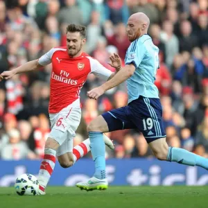 Arsenal's Ramsey Scores Past Collins in Arsenal v West Ham Premier League Clash