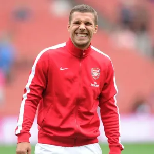 Arsenal's Ready Striker: Lukas Podolski Gears Up Against Aston Villa (2013-14)