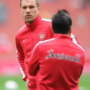 Arsenal's Ready-to-Go Striker: Lukas Podolski in Action vs. Aston Villa (2013-14)
