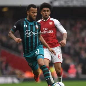 Arsenal's Reiss Nelson Closes In on Southampton's Ryan Bertrand in Intense Premier League Clash