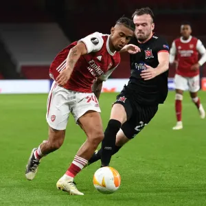 Arsenal's Reiss Nelson Goes Head-to-Head with Dundalk's Cameron Dummigan in Empty Emirates Stadium - UEFA Europa League 2020-21 Arsenal's Reiss Nelson Goes Head-to-Head with Dundalk's Cameron Dummigan in Empty Emirates Stadium - UEFA Europa League 2020-21