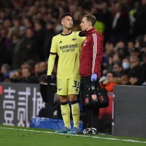 Arsenal's Ricky O'Donoghue Attends to Injured Gabriel Martinelli during Crystal Palace vs Arsenal (2021-22)