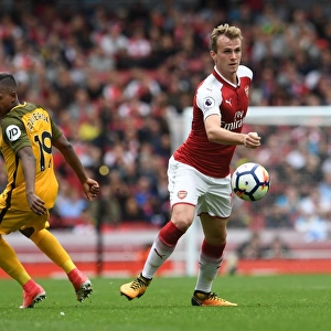 Arsenal's Rob Holding Battles Jose Izquierdo in Premier League Clash