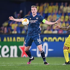 Arsenal's Rob Holding Clashes with Paco Alcacer in UEFA Europa League Semi-Final Against Villarreal
