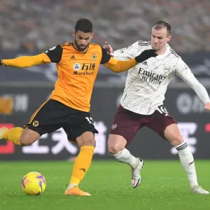 Arsenal's Rob Holding Closes In on Wolverhampton's Willian Jose in Intense Premier League Clash Arsenal's Rob Holding Closes In on Wolverhampton's Willian Jose in Intense Premier League Clash