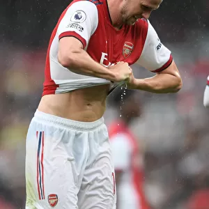 Arsenal's Rob Holding Rings Out Drenched Shirt in Heavy Premier League Rainfall (2021-22)