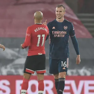 Arsenal's Rob Holding and Southampton's Nathan Redmond Exchange Handshakes in Empty St. Mary's Stadium - Southampton vs Arsenal, 2021 Premier League