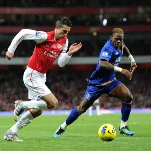 Arsenal's Robin van Persie Clashes with Everton's Louis Saha during the 2011-12 Premier League Match Arsenal's Robin van Persie Clashes with Everton's Louis Saha during the 2011-12 Premier League Match