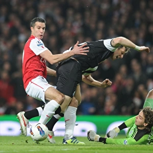 Arsenal's Robin van Persie Faces Off Against Newcastle's Mike Williamson and Tim Krul during the 2011-12 Premier League Match
