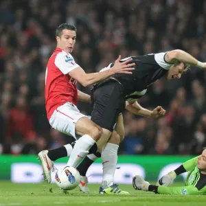 Arsenal's Robin van Persie Faces Off Against Newcastle's Mike Williamson and Tim Krul during the 2011-12 Premier League Match Arsenal's Robin van Persie Faces Off Against Newcastle's Mike Williamson and Tim Krul during the 2011-12 Premier League Match
