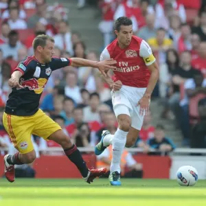 Arsenal's Robin van Persie Faces Off Against Teemu Tainio of New York Red Bulls during the 2011-12 Emirates Cup