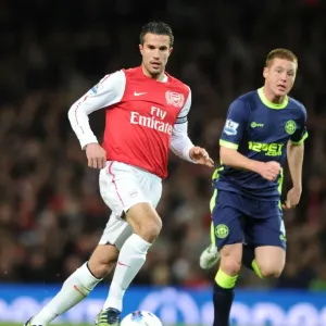 Arsenal's Robin van Persie Tackles Wigan's James McCarthy in 2011-12 Premier League Clash