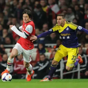 Arsenal's Rosicky Clashes with Swansea's Rangel in Premier League Showdown