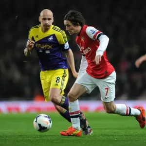 Arsenal's Rosicky Clashes with Swansea's Shelvey in Premier League Showdown