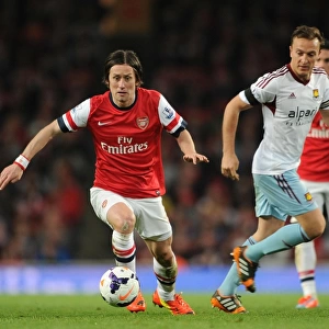 Arsenal's Rosicky Clashes with West Ham's Noble in Premier League Showdown