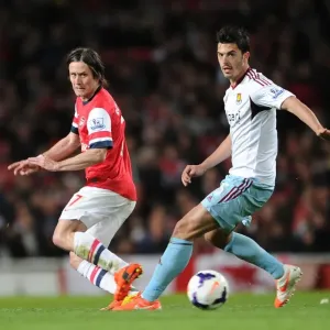 Arsenal's Rosicky Fends Off West Ham's Tomkins Pressure in Premier League Clash Arsenal's Rosicky Fends Off West Ham's Tomkins Pressure in Premier League Clash