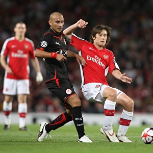 Arsenal's Rosicky and Ledesma Clash in Group H Showdown: Arsenal 2-0 Olympiacos, UEFA Champions League, Emirates Stadium, 2009