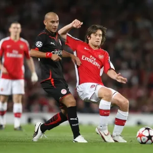 Arsenal's Rosicky and Ledesma Clash in Group H Showdown: Arsenal 2-0 Olympiacos, UEFA Champions League, Emirates Stadium, 2009
