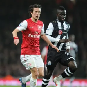 Arsenal's Rosicky Outmaneuvers Newcastle's Tiote in Premier League Clash (2011-12) Arsenal's Rosicky Outmaneuvers Newcastle's Tiote in Premier League Clash (2011-12)