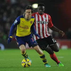 Arsenal's Rosicky Outmaneuvers Southampton's Wanyama in Premier League Clash (Southampton v Arsenal 2014-15)