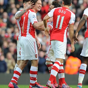 Arsenal's Rosicky and Ozil Celebrate Goals Against Everton in 2015 Premier League Match