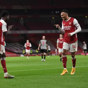 Arsenal's Saka and Aubameyang Celebrate Goals in Empty Emirates Stadium Against Newcastle United (2021)