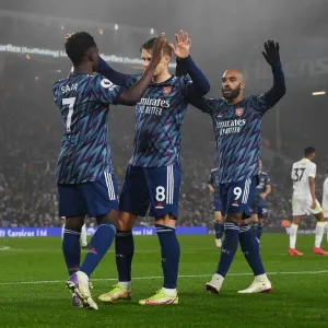 Arsenal's Saka, Odegaard, and Lacazette: Celebrating Goals Against Leeds United (December 2021) Arsenal's Saka, Odegaard, and Lacazette: Celebrating Goals Against Leeds United (December 2021)