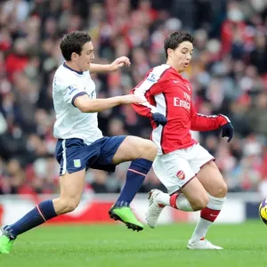 Arsenal's Samir Nasri Scores Against Stuart Downing and Aston Villa in 3-0 Premier League Victory at Emirates Stadium Arsenal's Samir Nasri Scores Against Stuart Downing and Aston Villa in 3-0 Premier League Victory at Emirates Stadium