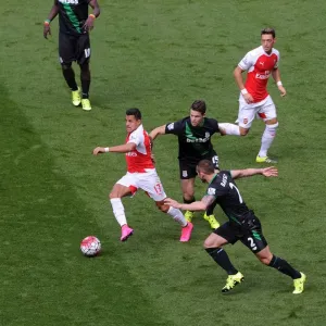 Arsenal's Sanchez and Ozil Go Head-to-Head with Stoke's Van Ginkel and Diouf Arsenal's Sanchez and Ozil Go Head-to-Head with Stoke's Van Ginkel and Diouf