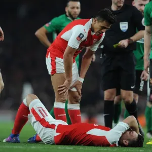 Arsenal's Sanchez and Ozil: A Moment of Support in FA Cup Quarter-Final Arsenal's Sanchez and Ozil: A Moment of Support in FA Cup Quarter-Final