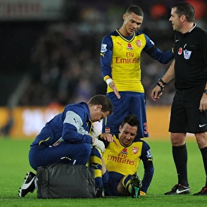 Arsenal's Santi Cazorla Receives Treatment from Physio Amid Swansea Tussle