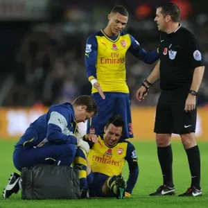 Arsenal's Santi Cazorla Receives Treatment from Physio Amid Swansea Tussle