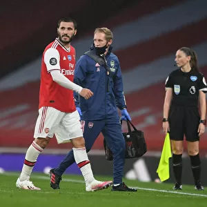Arsenal's Sead Kolasinac Receives Treatment from Physio during Arsenal v Leicester City Match, 2019-2020