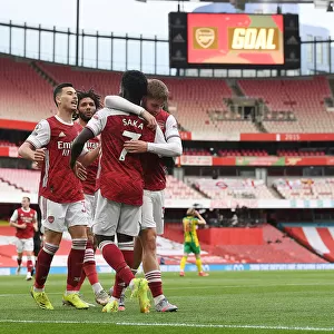 Arsenal's Smith Rowe, Martinelli, and Saka Celebrate First Goal Amid Empty Emirates Stadium (2021)