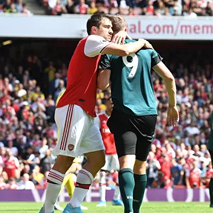 Arsenal's Sokratis Embraces Burnley's Chris Wood in Premier League Clash