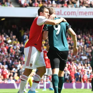 Arsenal's Sokratis Embraces Burnley's Chris Wood in Premier League Clash Arsenal's Sokratis Embraces Burnley's Chris Wood in Premier League Clash