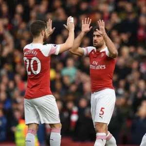 Arsenal's Sokratis and Mustafi Share a Moment Before the Arsenal v Tottenham Clash