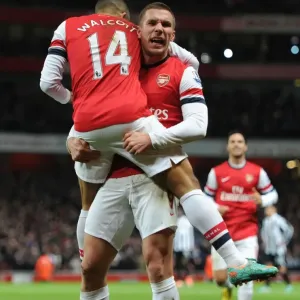 Arsenal's Star Duo: Walcott and Podolski Celebrate First Goal Against Newcastle United (2012-13)