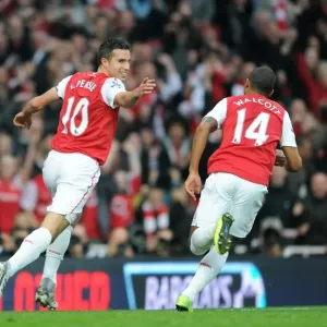 Arsenal's Star Strikers: Robin van Persie and Theo Walcott Celebrate First Goal in 3-0 Premier League Victory over West Bromwich Albion (2011)
