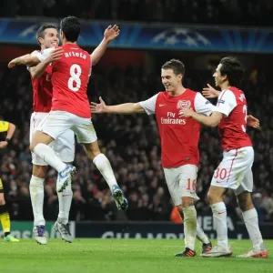 Arsenal's Star Strikers: Van Persie, Arteta, Ramsey, and Benayoun Celebrate Goals Against Borussia Dortmund in the 2011-12 Champions League