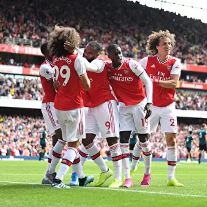 Arsenal's Stars: Guendouzi, Lacazette, Pepe, and Luiz Celebrate Second Goal vs. Burnley (2019-20 Premier League)
