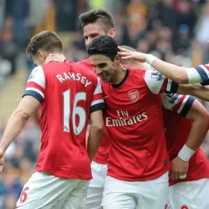 Arsenal's Stars: Podolski, Ramsey, Ozil, and Giroud Celebrate Goals Against Hull City (April 2014)