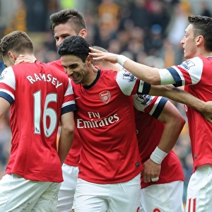Arsenal's Stars: Podolski, Ramsey, Ozil, and Giroud Celebrate Goals Against Hull City (April 2014)